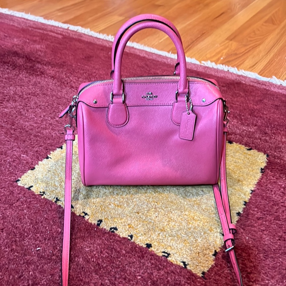 Pink Coach bag with handles and removable crossbody strap